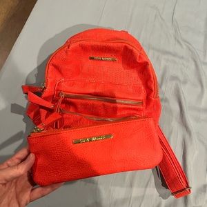 Steve Madden coral mini backpack with matching wallet.